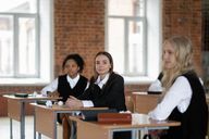 A student with their laptop on their lap.